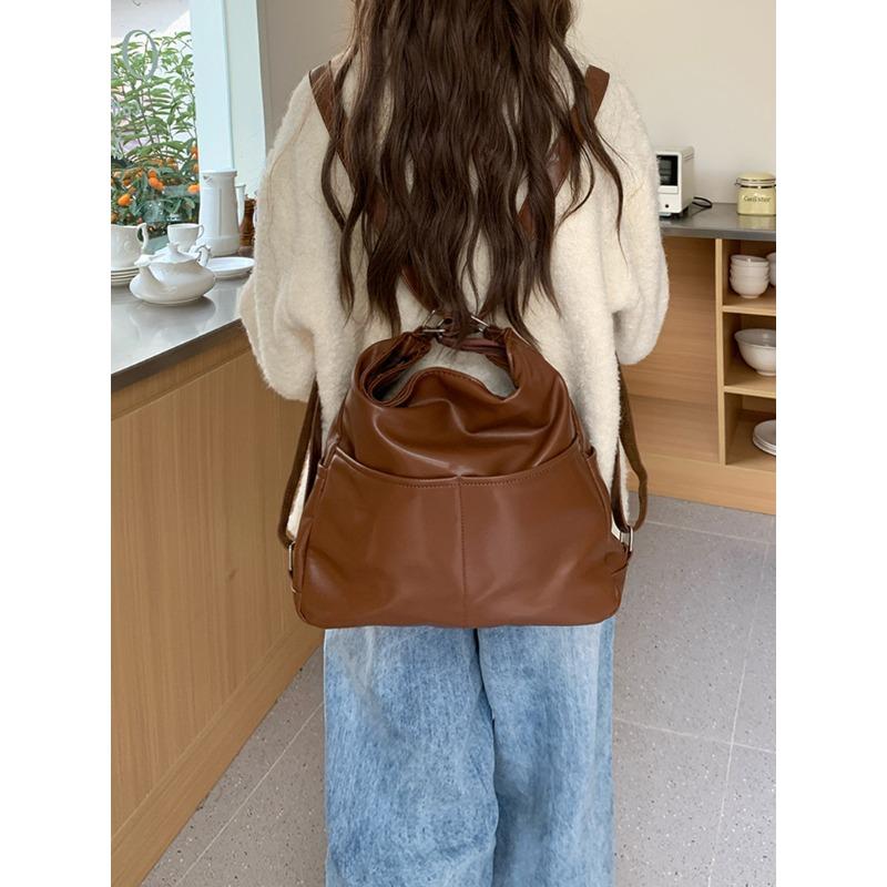 

Spring soft leather backpack bag women s large-capacity three-purpose commuter tote bag multi-functional backpack oblique span schoolbag tide коричневый
