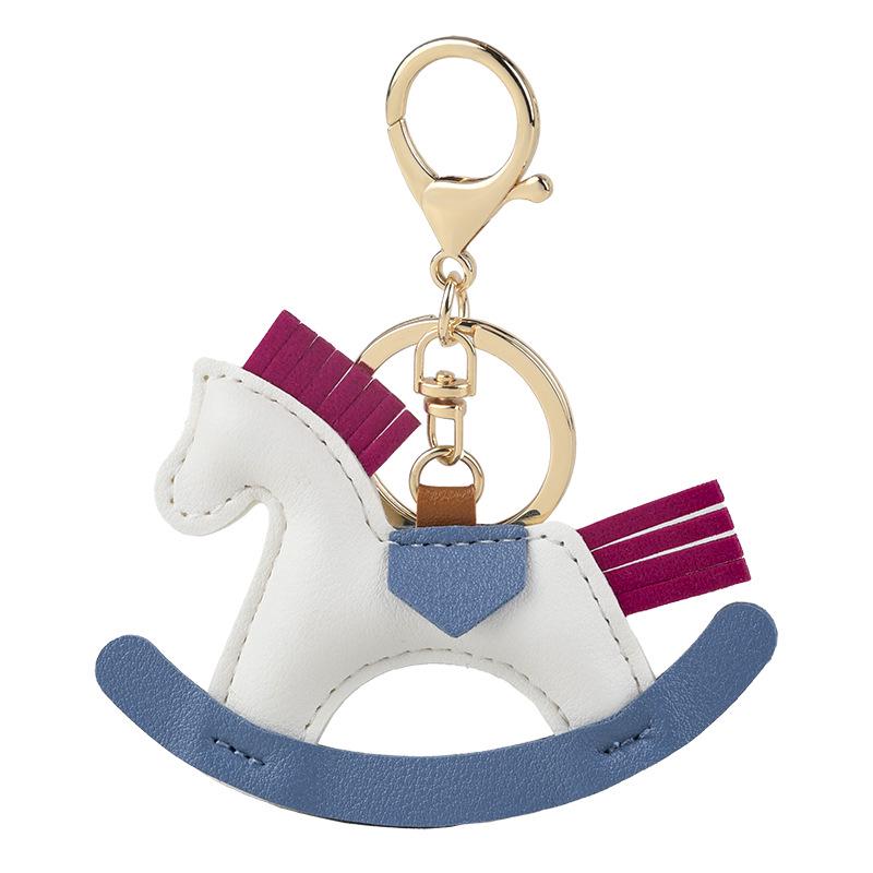 

Детский мультяшный брелок-качалка в виде лошадки - подвеска из дерева и кожи ручной работы белый