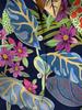 Women's shirt, featuring a vibrant tropical floral design, with long sleeves and button closure, is perfect for beach vacations and casual outings.