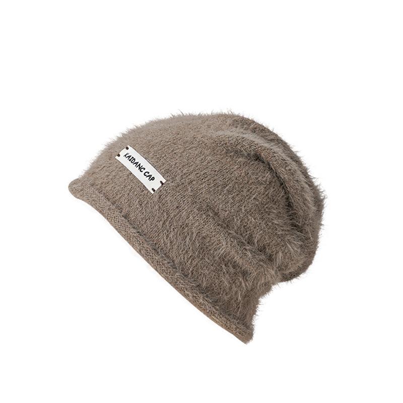 Herbst und Winter neue Stapelmützen Kinder lockeres Gesicht kleine Baotou-Mütze Ohrenschützer kalte Mütze flauschige warme Überziehmütze