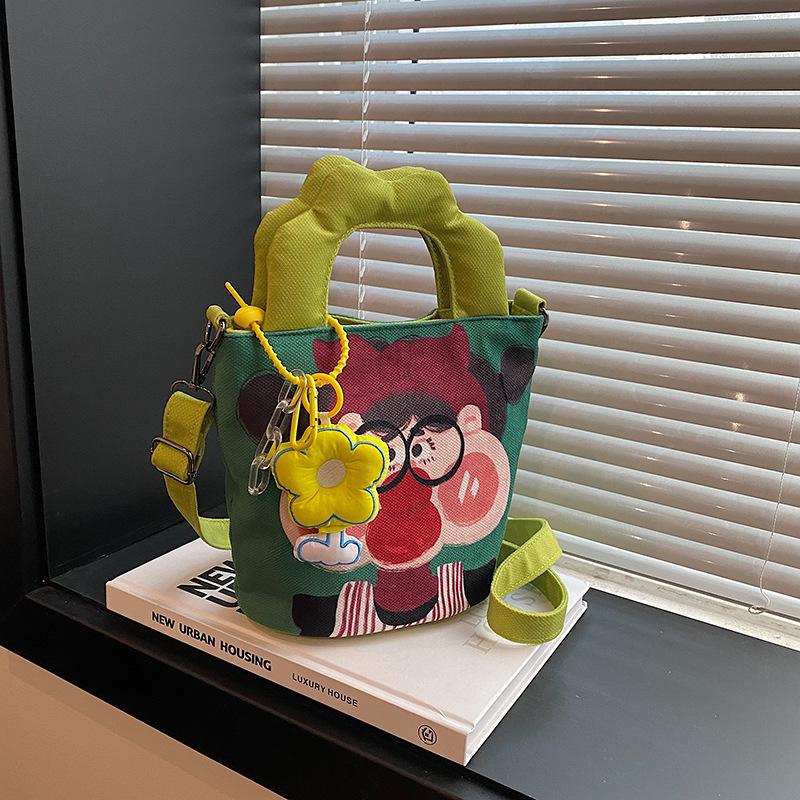 2025 Grenzüberschreitende Cartoon-Graffiti-Handtasche: Nischendesign Bucket Schulter- & Umhängetasche für Damen