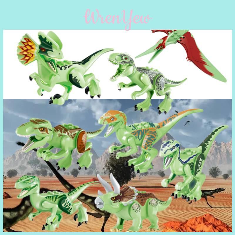 Conjunto de 8 blocos de montar fluorescentes de dinossauros jurássicos para crianças. Material atóxico e seguro.