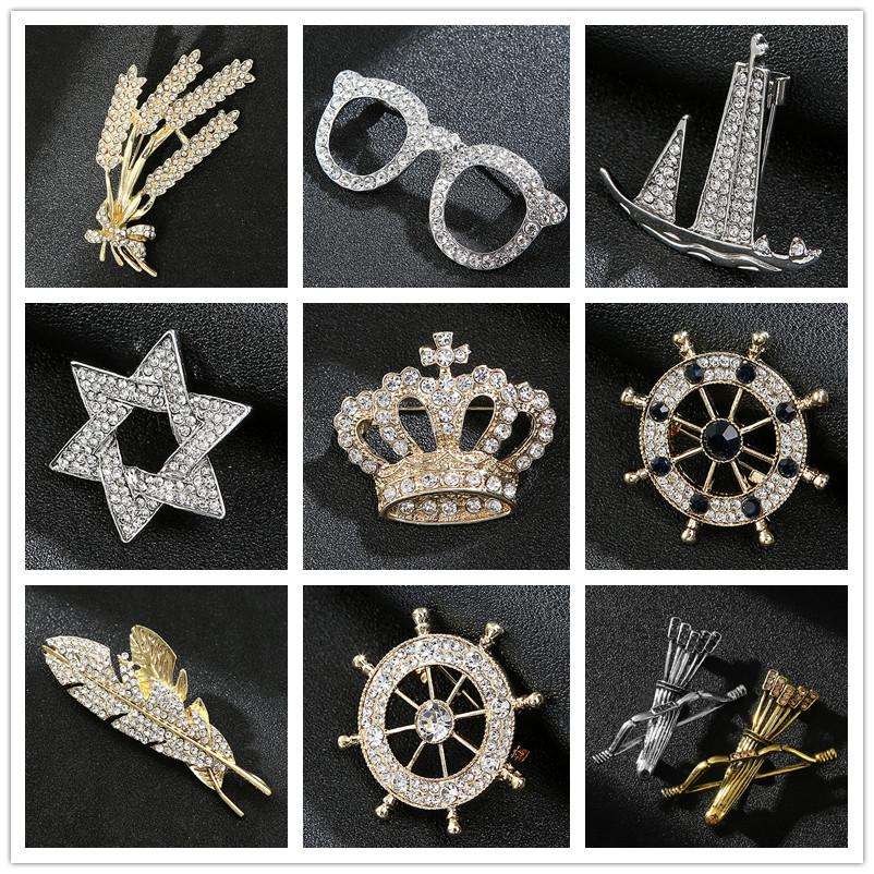 Spilla a spilla da uomo con timone di barca a vela e corona d'aquila con strass