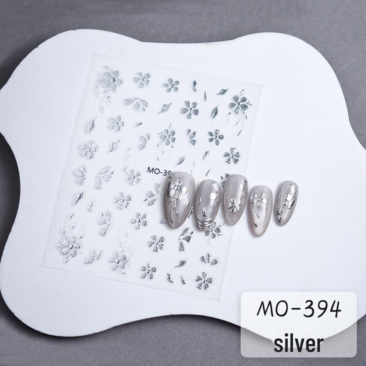 

Золотые и серебряные наклейки для ногтей в виде маленьких цветов с трехмерным рисунком бабочек и рельефными цветами из пяти лепестков для создания модного маникюра. MO-394