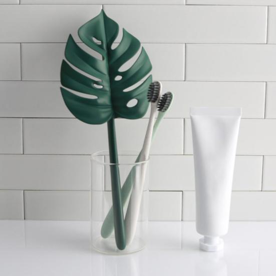 Nástroj na čištění sprchové stěrky ve tvaru zeleného listu