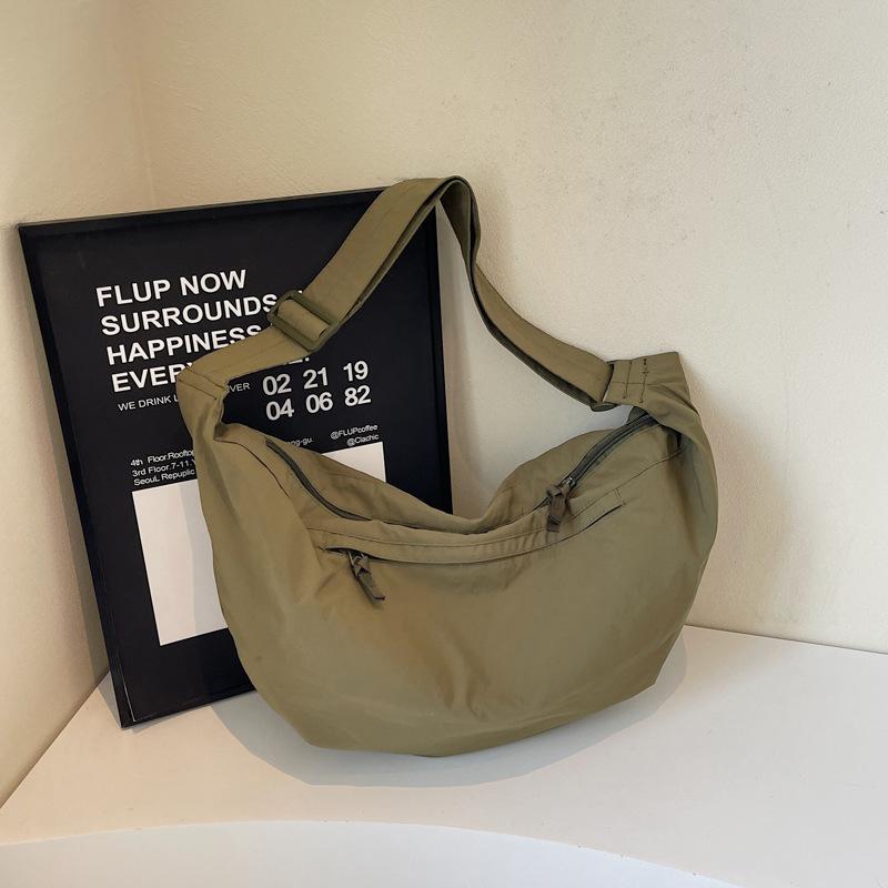 2025 women's bag Korean version ins canvas dumpling bag fashion casual messenger bag simple breast bag trendy bag