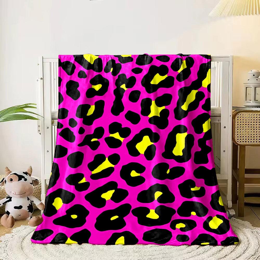 Bold leopard print with black spots, yellow centers, on a pink background. for all seasons blanket lunch break throw gift