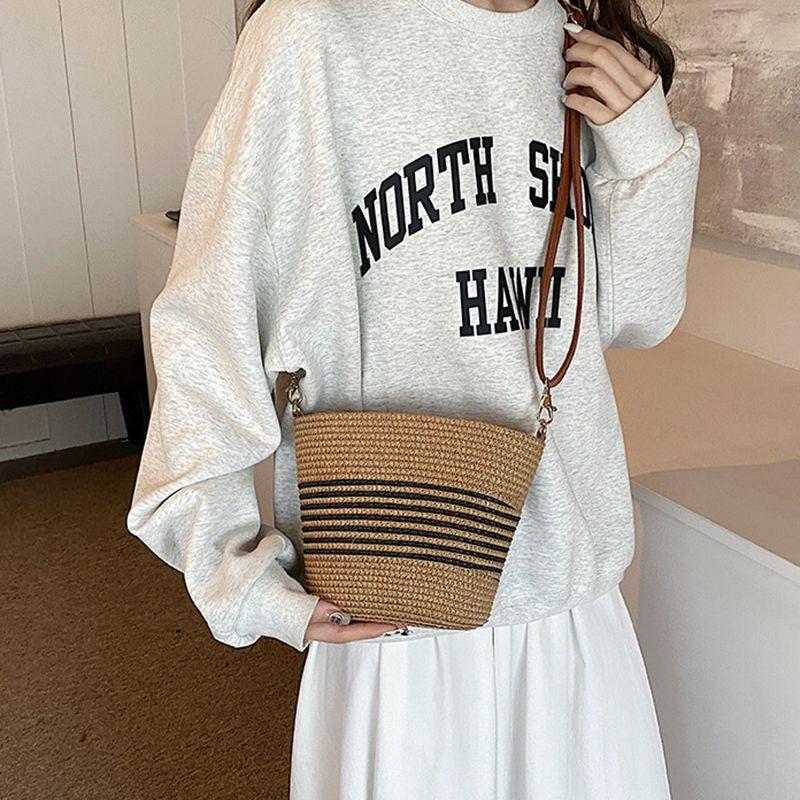 

Summer super fire mini small bag women s new versatile messenger straw woven high-end seaside beach mobile phone bag
