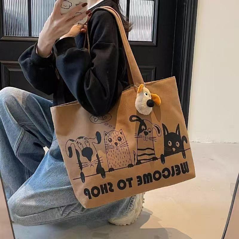 

Large capacity cartoon canvas bag women s new casual versatile shoulder bag student class portable commuter tote bag коричневий