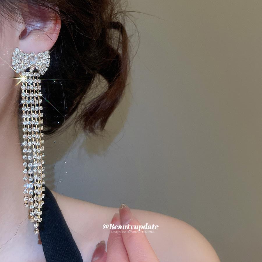 Elegant Silver Rhinestone Bow Tassel Earrings: Luxury Ear Studs for Women