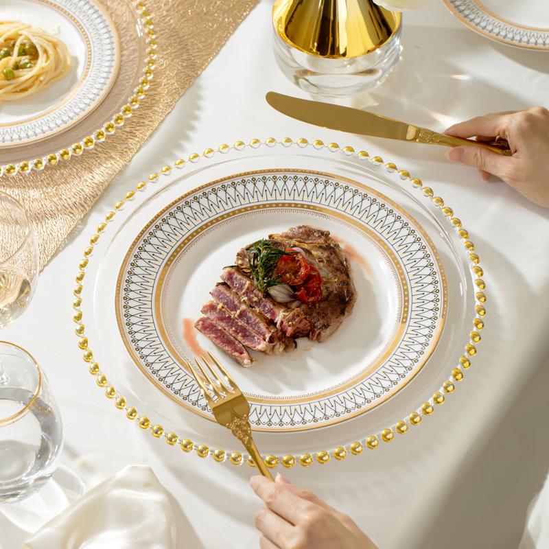 European Style Gold Rim Ceramic Dinnerware Set - Includes Large Bowls, Soup Bowls, Plates, and Rice Bowls for New Year Celebrations.