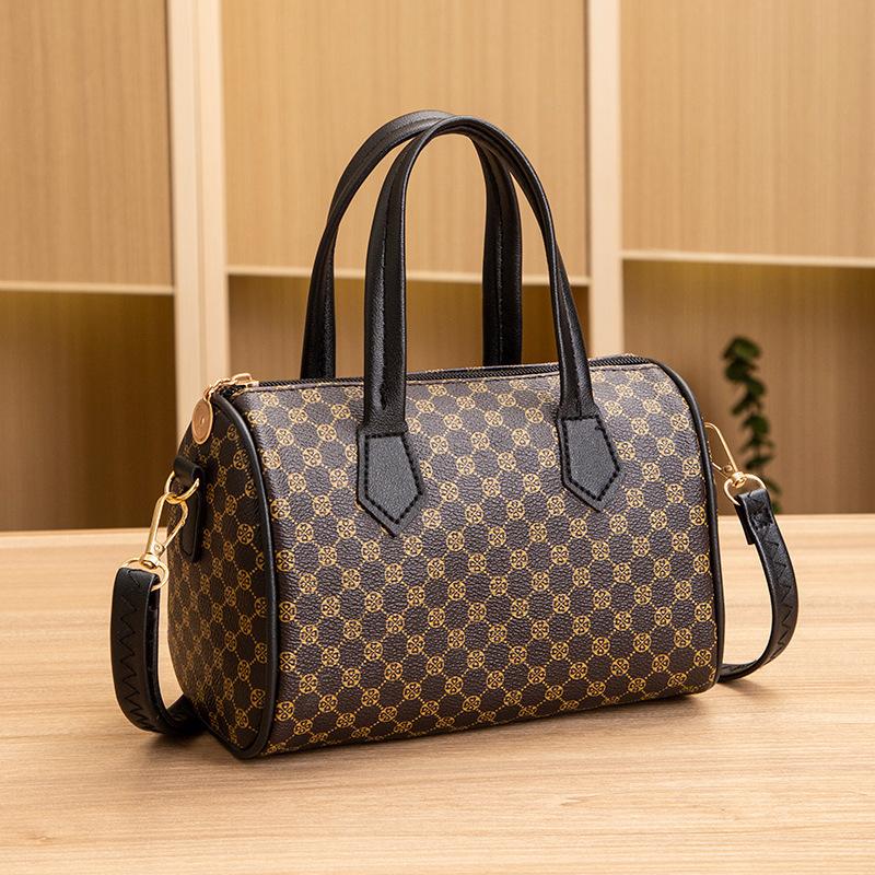 

New plaid women s bag, cylindrical bag, pillow bag, women s bag, and a portable oblique span bag. 19.5*12*13