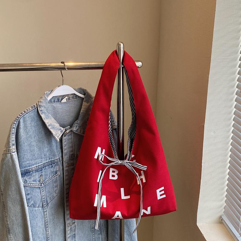 Large capacity double-sided canvas bag women's 2025 new color letter bow shoulder bag fashion student schoolbag