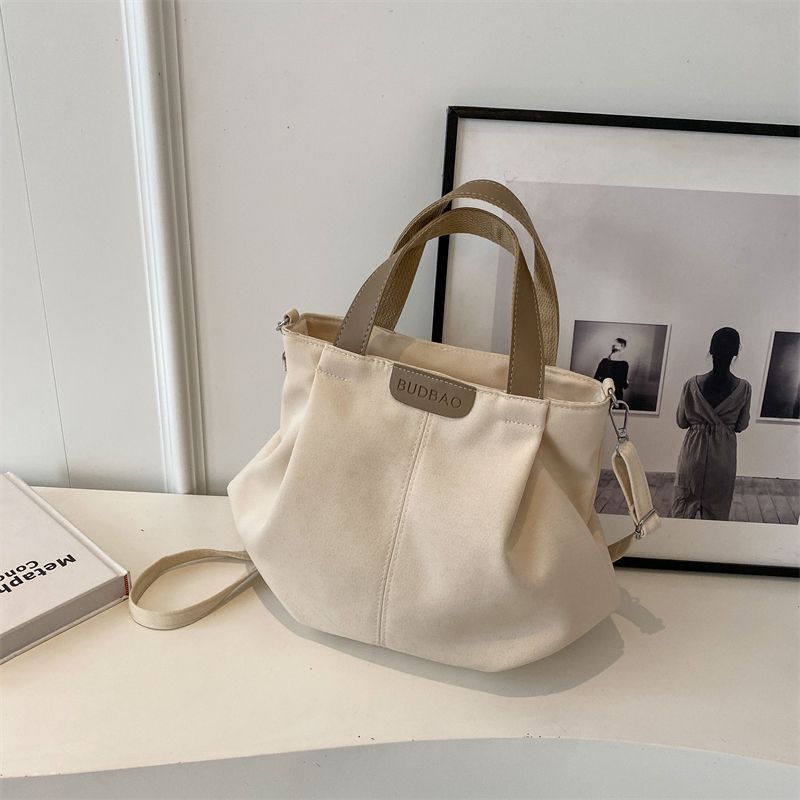 Casual canvas bag women's new versatile simple shoulder handbag fashionable large-capacity student class shoulder bag