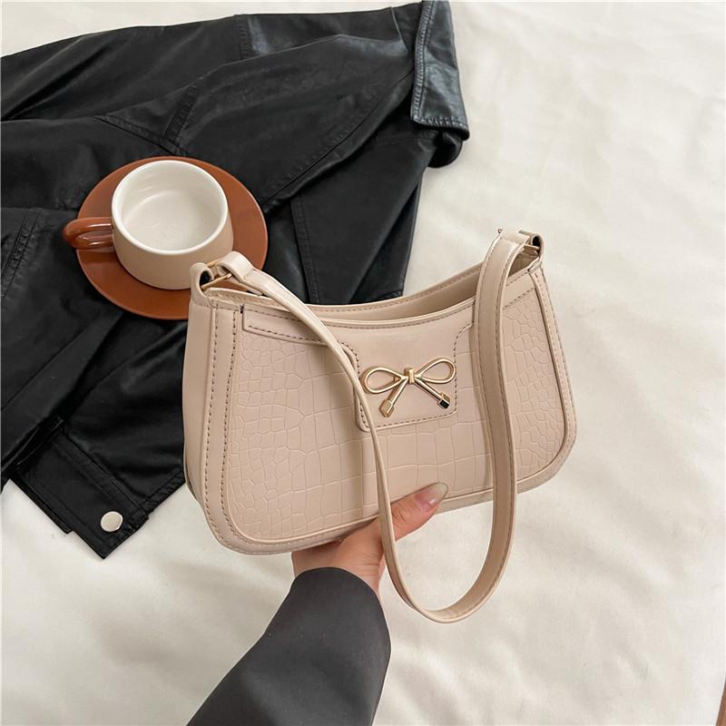 

Textured fashion bow portable small square bag women s 2025 new commuter shoulder bag crocodile pattern armpit bag