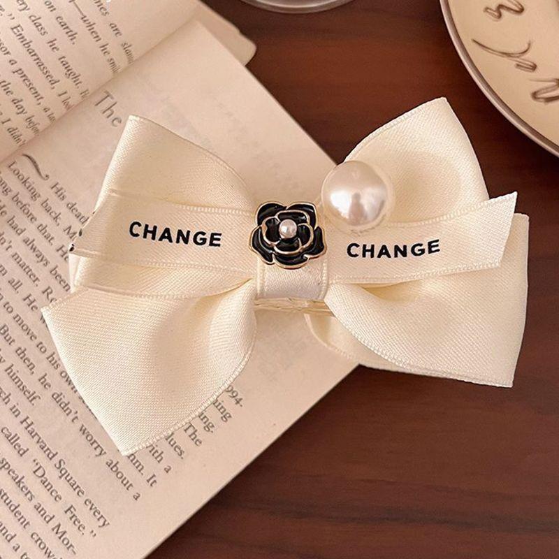 

1pc Retro exquisite bow French light luxury camellia hair clip, meatball head, grab clip, female ponytail clip, dished hair