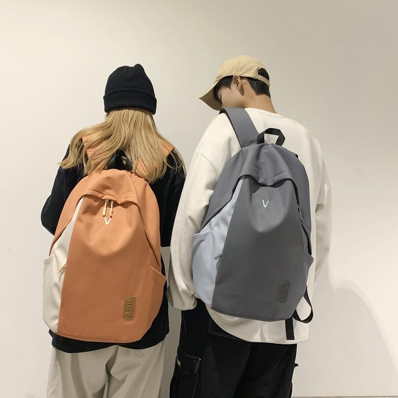 A Male College Student with A Small Simple Large-capacity Computer Backpack