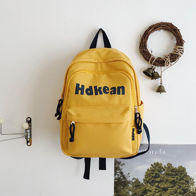 New High-value Solid Color Simple Letter Backpack Couple Casual Lightweight Large-capacity Backpack