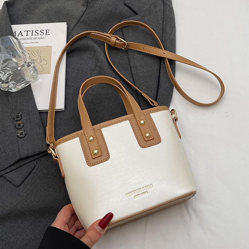 2025 fashion trend high sense niche design contrasting colors portable bucket bag versatile commuter temperament messenger bag woman