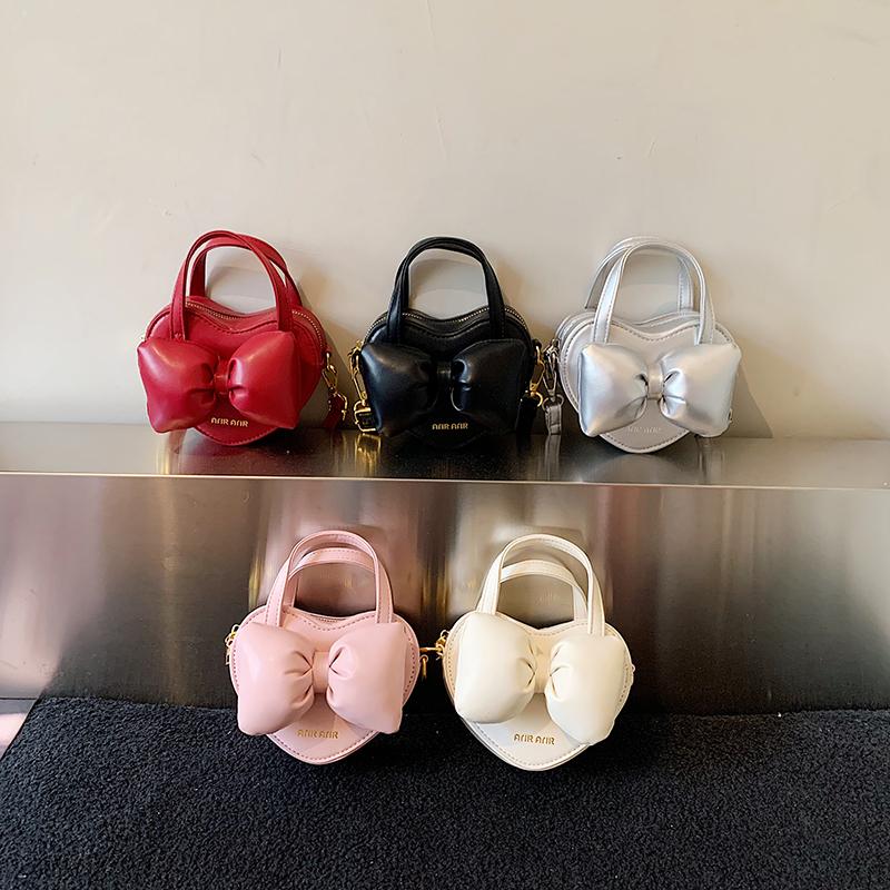 2026 New Cute Heart Shape Bow Mini Crossbody Bag Solid PU Sweet Bowknot Handbag Fashion Personality Shoulder Bag for Women Girls