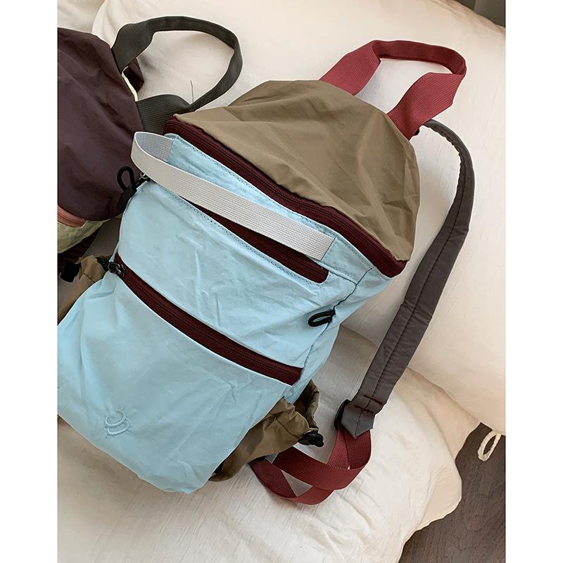 

Контрастная цветная повседневная нейлоновая альпинистская сумка женская 2025 новая модная корейская версия рюкзак большой емкости дорожная сумка синий