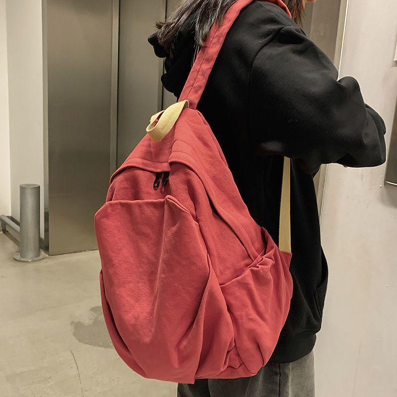 2025 Durable Canvas Solid Color Backpack for Female College Students - Korean and Japanese Style Travel Schoolbag
