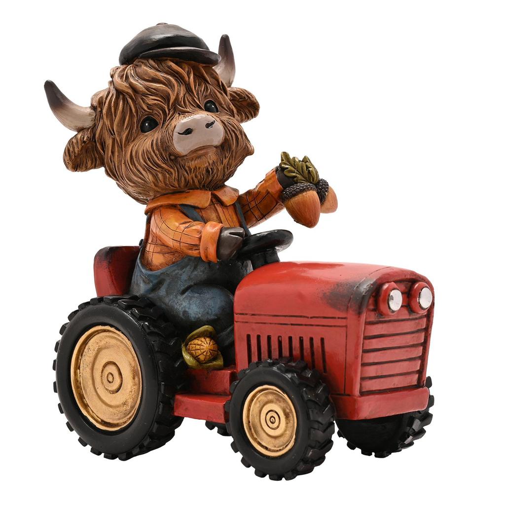 Country Living Highland Cow on Tractor