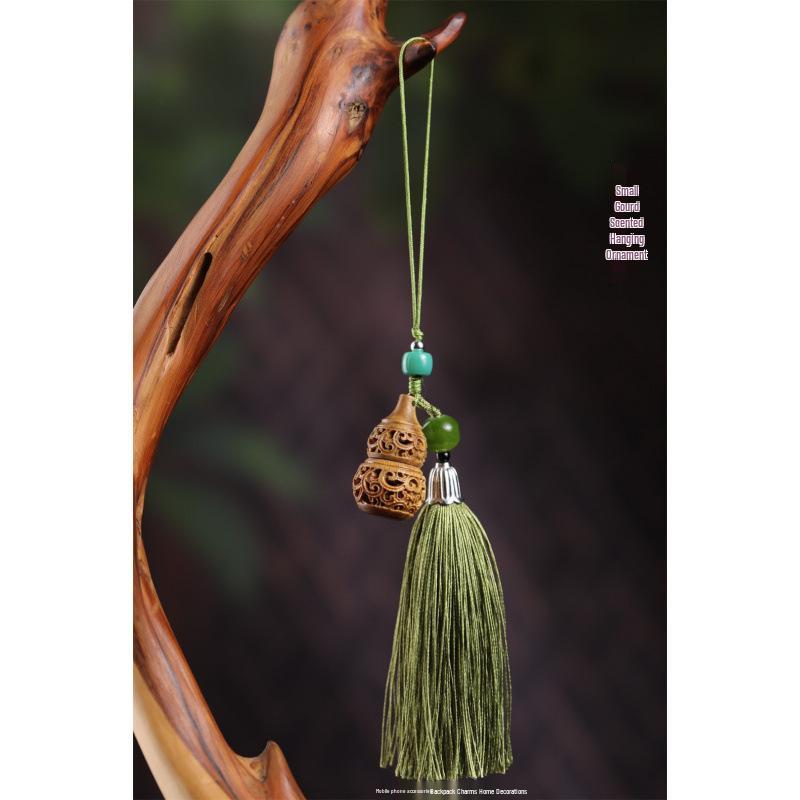 Green Sandalwood Hollowed-Out Sachet Ball: Retro Incense Pendant for Car, Phone, or Backpack.