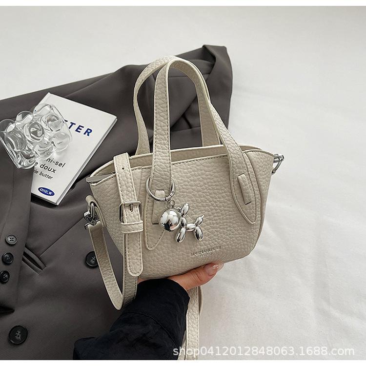 

Fashion lychee pattern portable wing bag 2025 new niche design messenger bag casual soft surface commuter shoulder bag