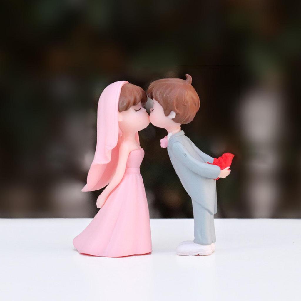 Charming Wedding Cake Topper Featuring Miniature Bride and Groom