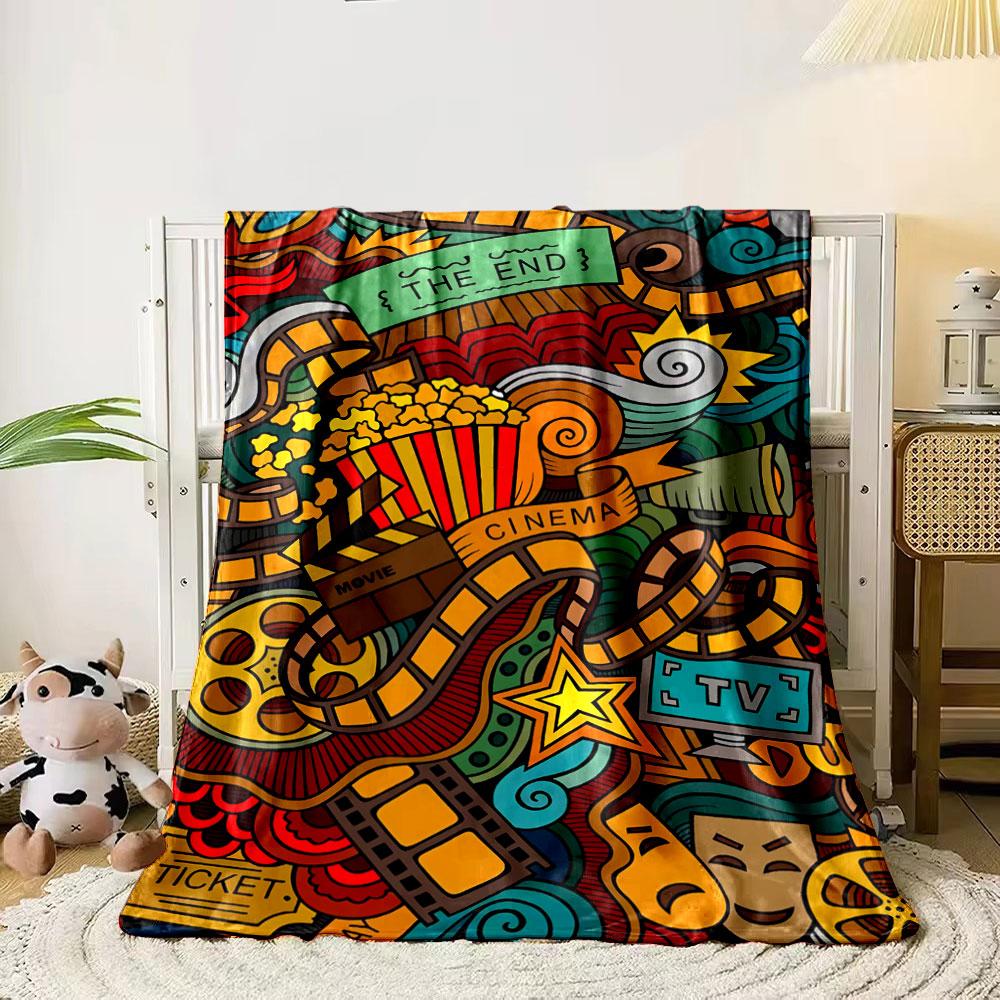 

A colorful cinema-themed doodle with film reels, popcorn, and TV icons. for all seasons blanket lunch break throw gift 80cm x 120cm