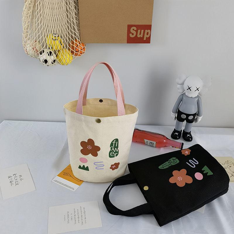 Damenhandtasche aus Canvas mit Nischendesign und Aufdruck, zum Mitnehmen von Lunchboxen, Bento-Stoffbeutel, einfache, vielseitige Einkaufstasche im literarischen Eimer-Stil