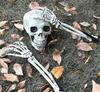 Halloween decorations, venue layout props, skulls, skeletons, ghosts on the ground