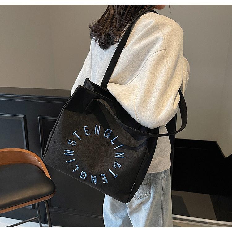 Literary letter canvas bag women's large capacity 2025 new simple shoulder college student tote bag