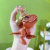 Tyrannosaurus Rex Biting A Hand Keychain - Creative Dinosaur Small Pendant for Couples' Schoolbag, A Small Gift.