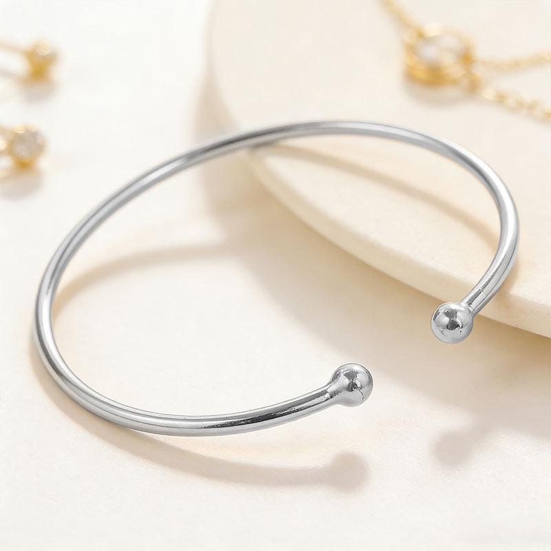 Adjustable Metal Arm Bracelet with Dual Balls & Water Drop Design: Exaggerated Style for Women