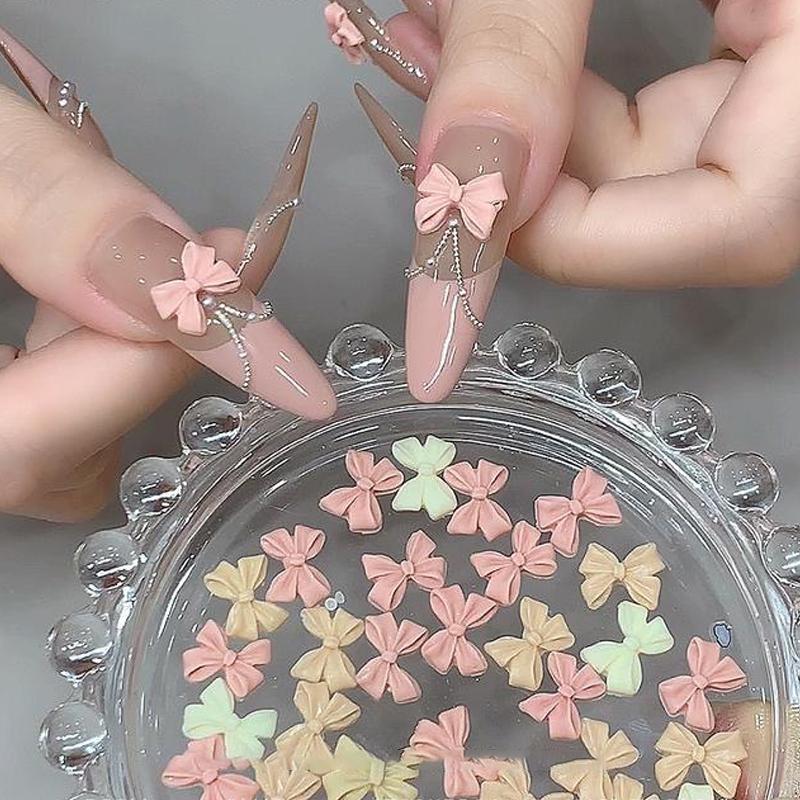 100Pcs Mix Cream Style Bowknot Nail Charms 3D Aurora Bow Flat-Back Gems Parts Nail Art Manicure Decorations