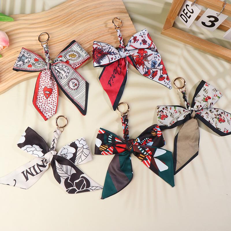 Porte-clés nœud papillon ruban élégant coréen écharpe en soie douce porte-clés porte-clés de voiture breloques de sac pour femmes accessoires de clés pour cadeaux de fille