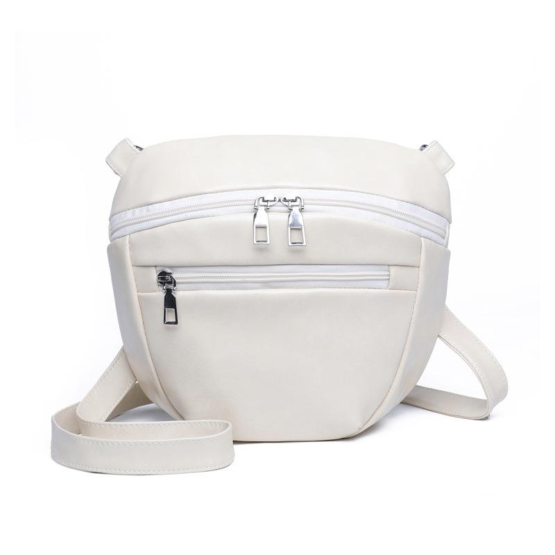 

Спортивная поясная сумка модная и простая. Женская нагрудная сумка — это нишевая и ретро маленькая сумка кроссбоди для девочек. бежевый