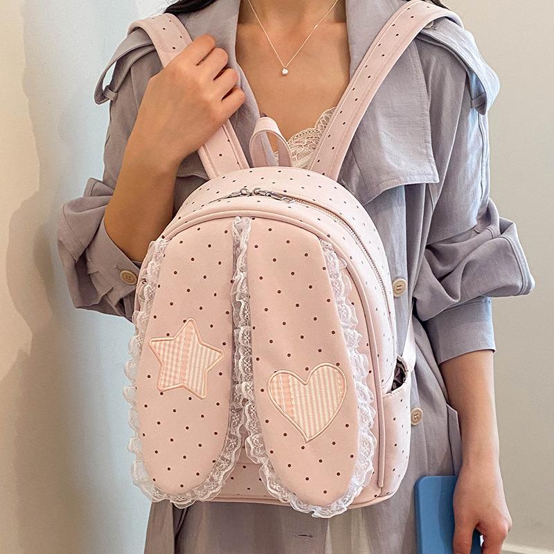 Schoolbag handsome rice family Korean simple foreign style polka dot love rabbit ear backpack 1011 spring new commuter student backpack