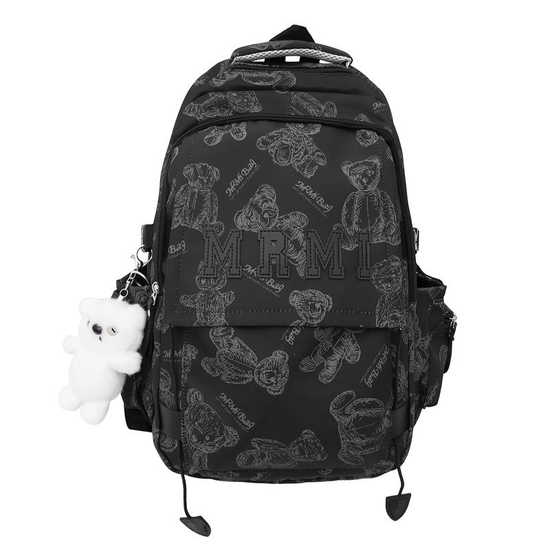 The new bear graffiti backpack has a large capacity of foreign style tide and a couple of middle and high school students have a class backpack tide.