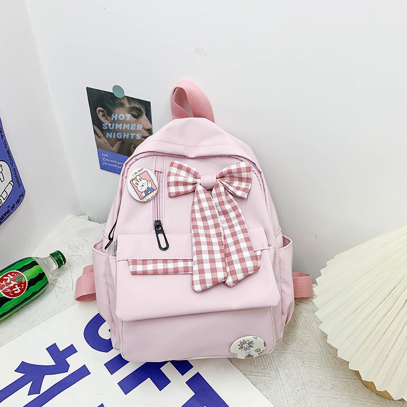 Bow schoolbag Female primary school students Large capacity 3rd to 6th grade high school lightweight weight weight reduction Cute simple backpack