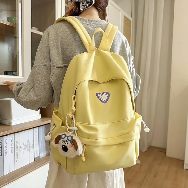 School bags, female college students, simple solid colors, love, junior high student, niche and versatile girls, high school student backpacks, trends