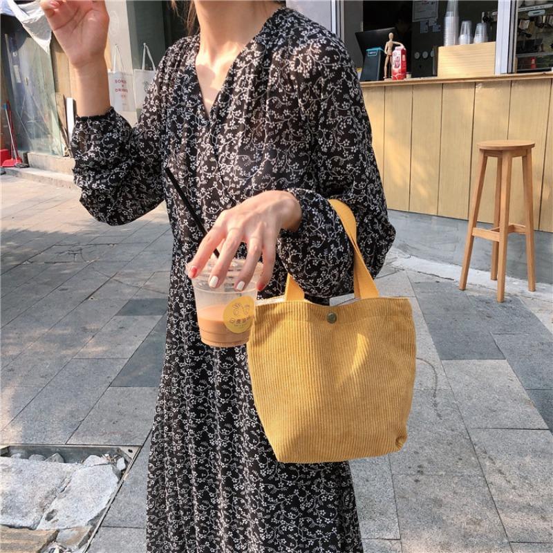 [Spot] Literary and artistic corduroy bag portable casual women's small hand bag retro cloth bag bento bag