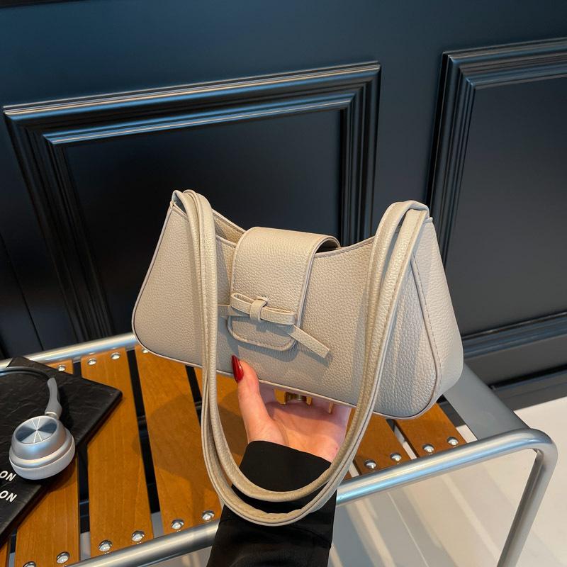 Korean version of premium bow underarm women's bag 2025 summer trendy simple casual baguette bag shoulder handbag