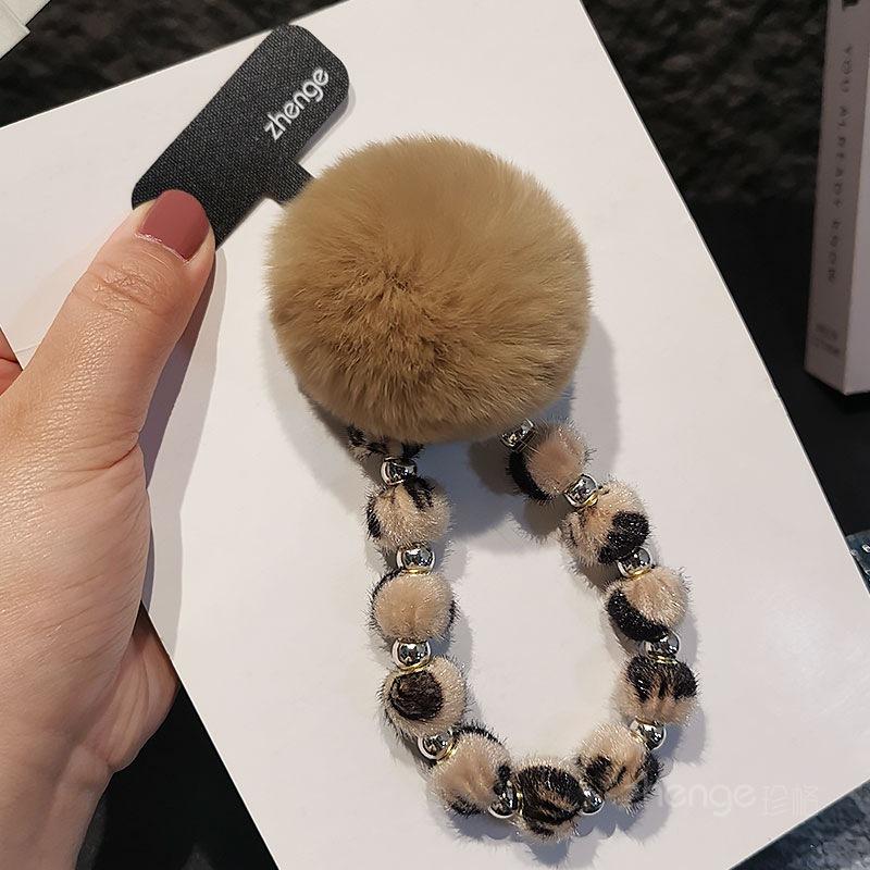 

Premium leopard print hairball mobile phone chain ins fashion women s wrist pendant mobile phone case bag pendant beaded lanyard khaki khaki big fur ball