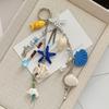 New Starfish Keychain: Ocean-Themed Keychain with Multiple Charms (Starfish, Shell, and Fish Shapes)