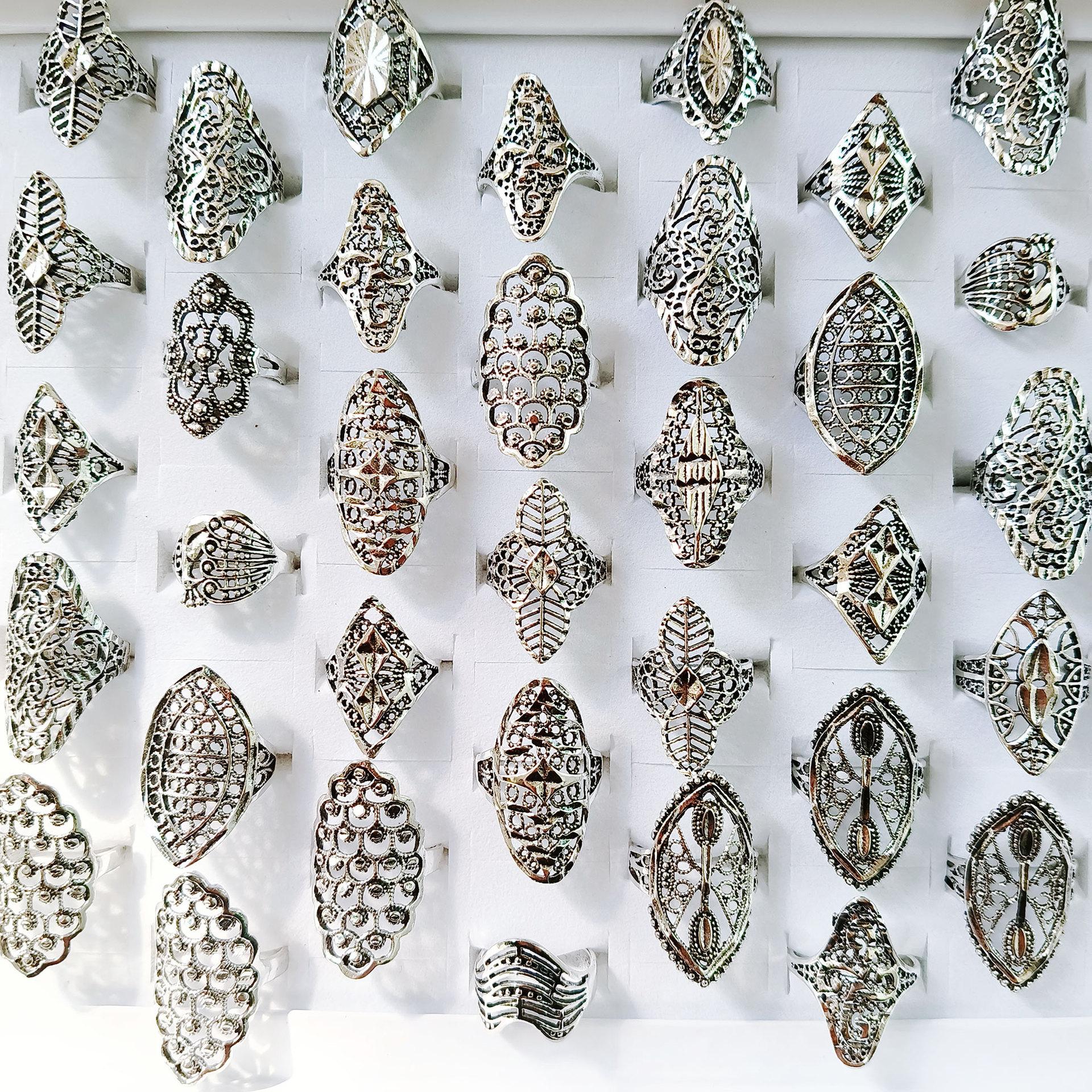 Retro style wide face finger ring with hollow pattern and unique design for women s jewelry accessory