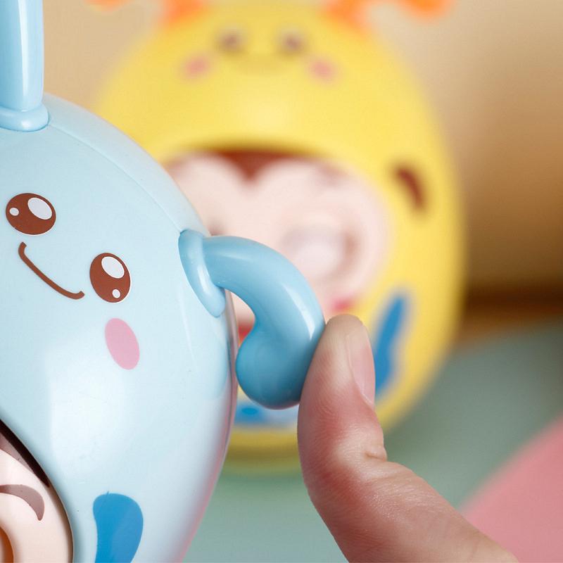 Mobile Doll Bell Baby Toy Rattles Blink Eyes Tumbler Roly-poly Silicon Teether 