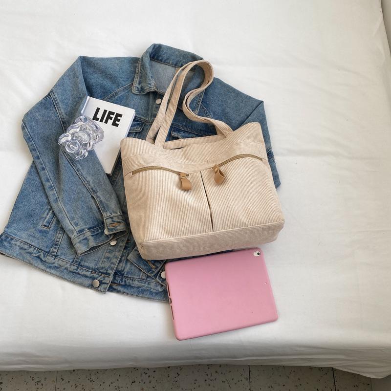 

Canvas bag bag women s large capacity 2025 new shoulder bag niche design sense college students commuting tote bag хакі